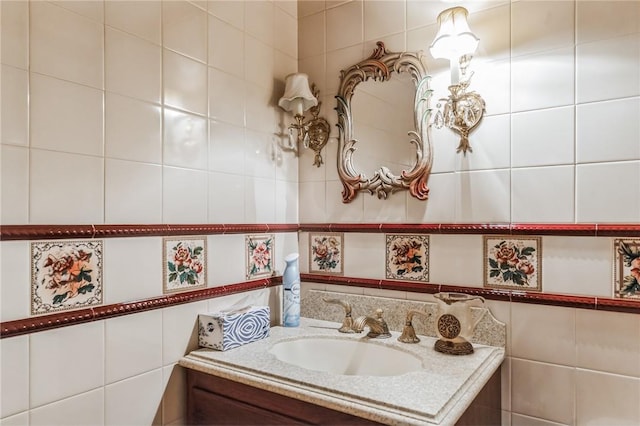 bathroom with vanity and tile walls