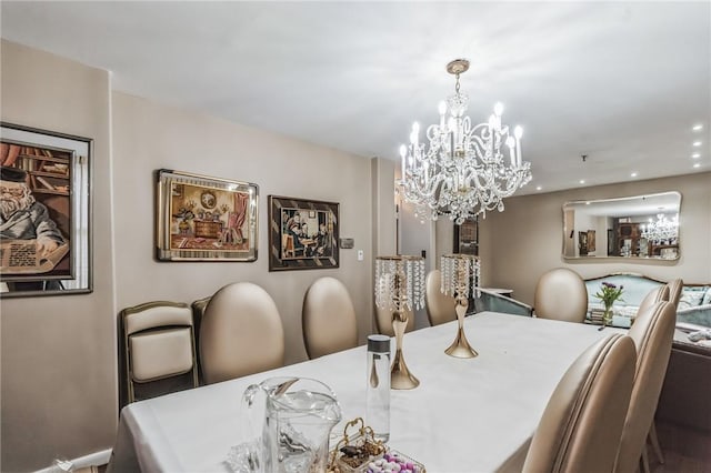 dining area with an inviting chandelier