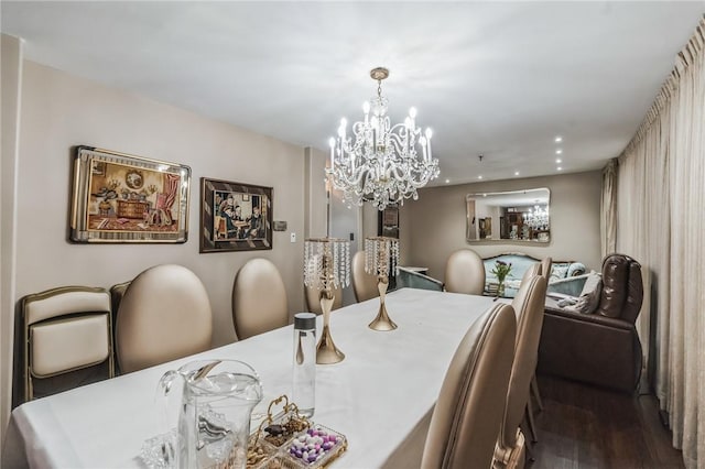 dining room featuring dark hardwood / wood-style floors and a notable chandelier