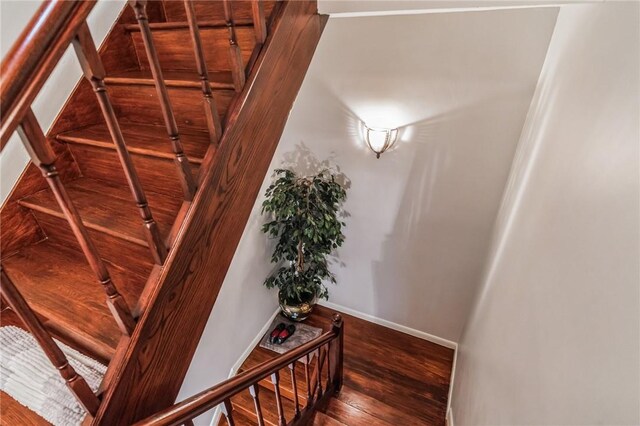 stairway featuring hardwood / wood-style flooring