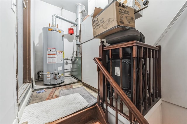 utility room with gas water heater