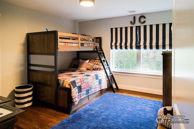 bedroom featuring dark wood-type flooring