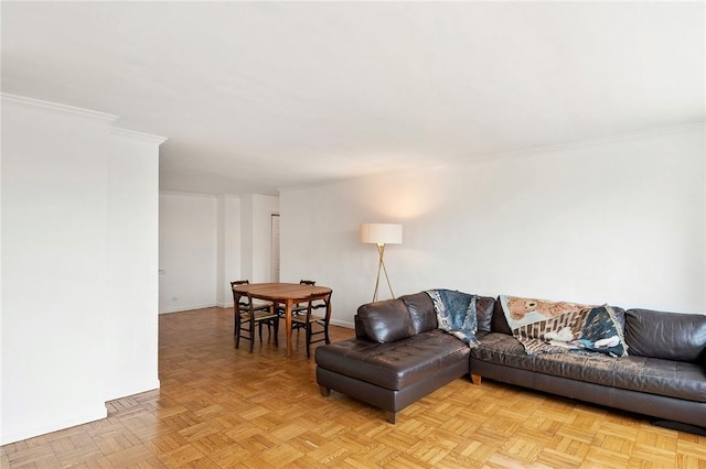 living room featuring light parquet floors and crown molding