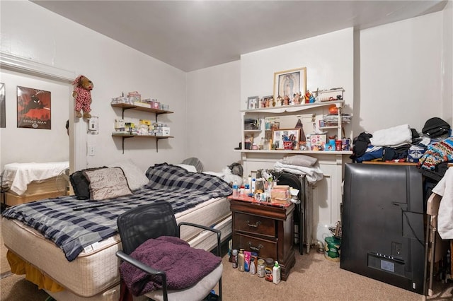 bedroom featuring light carpet