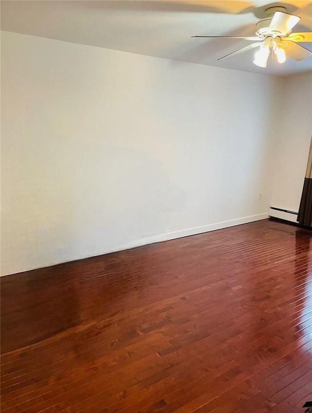 unfurnished room featuring ceiling fan, dark hardwood / wood-style flooring, and a baseboard radiator