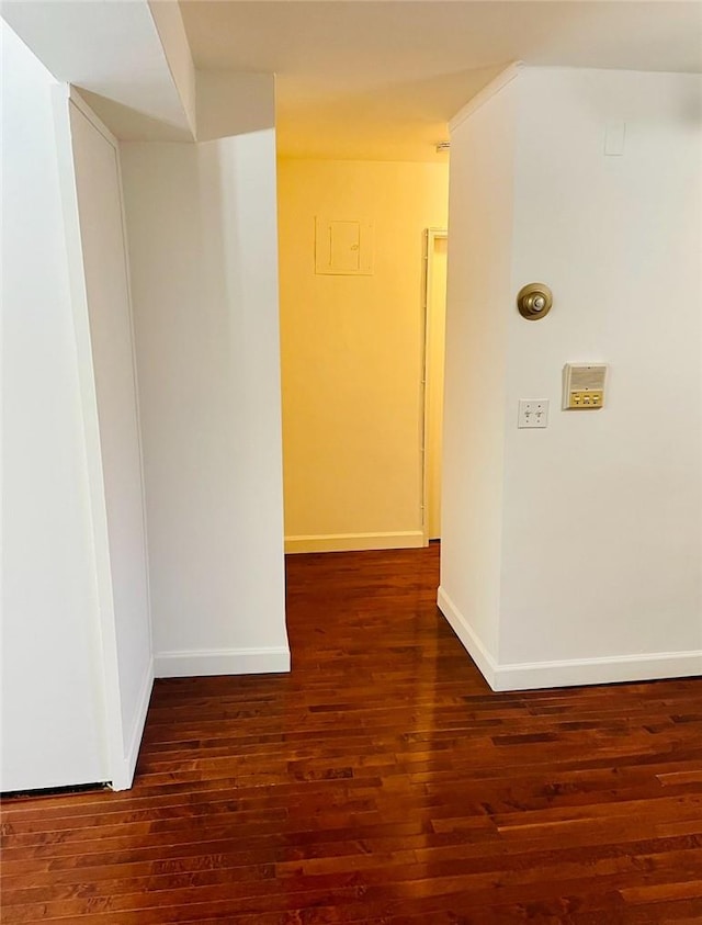 hallway with dark wood-type flooring