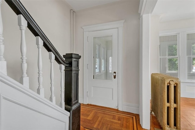 foyer entrance with radiator and parquet flooring