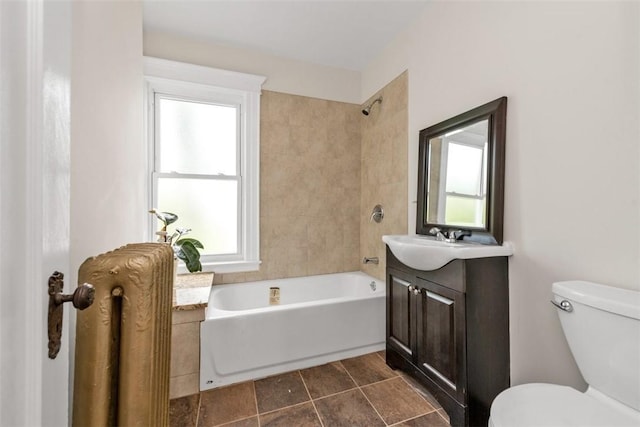 bathroom featuring vanity, toilet, and a wealth of natural light