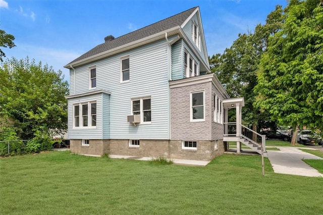 view of home's exterior featuring a yard and cooling unit