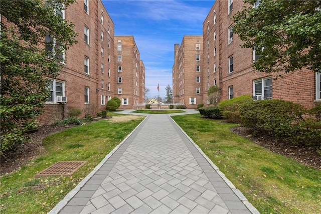 view of home's community with a yard