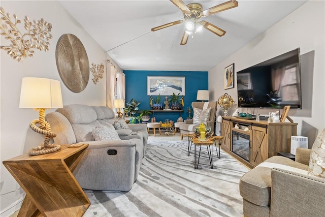 living room featuring carpet and ceiling fan