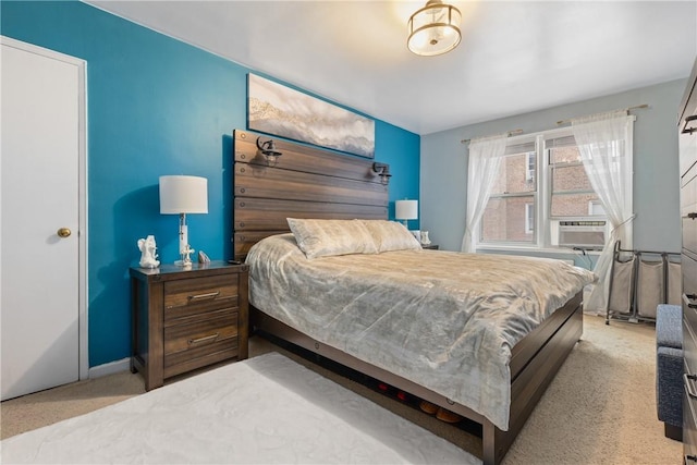 bedroom featuring light colored carpet and cooling unit