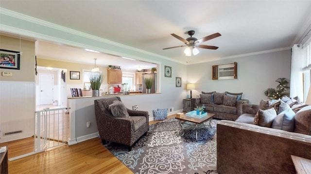 59 Ludingtonville Rd, Holmes, NY 12531 - living room featuring light wood-type flooring, a ceiling fan, and ornamental molding
