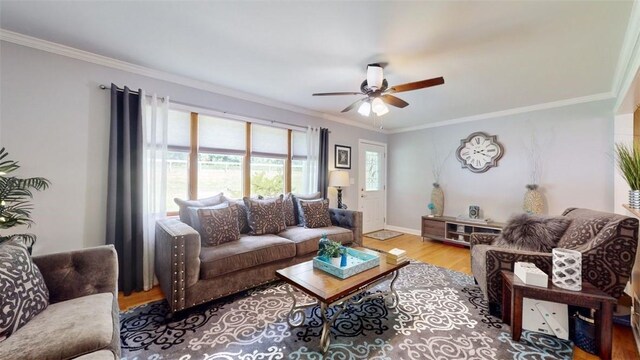 59 Ludingtonville Rd, Holmes, NY 12531 - living room featuring ornamental molding, a ceiling fan, wood finished floors, and baseboards