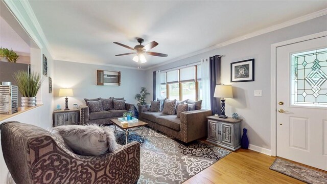 59 Ludingtonville Rd, Holmes, NY 12531 - living room with wood finished floors, a ceiling fan, ornamental molding, and baseboards