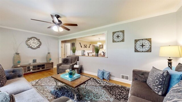 59 Ludingtonville Rd, Holmes, NY 12531 - living area featuring wood finished floors, ceiling fan, crown molding, and baseboards
