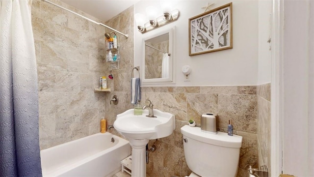 59 Ludingtonville Rd, Holmes, NY 12531 - bathroom featuring toilet, shower / bathtub combination with curtain, and tile walls