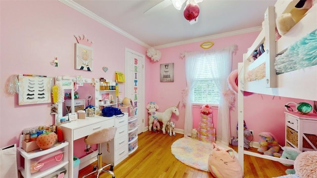 59 Ludingtonville Rd, Holmes, NY 12531 - bedroom with crown molding, light wood-style floors, an office area, a ceiling fan, and baseboards