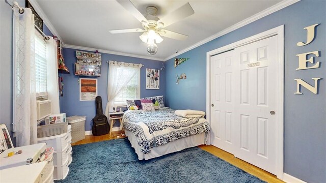 59 Ludingtonville Rd, Holmes, NY 12531 - bedroom featuring wood finished floors, crown molding, a closet, a ceiling fan, and baseboards