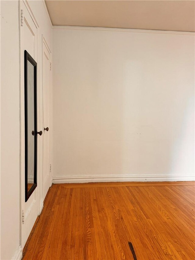 empty room with hardwood / wood-style floors