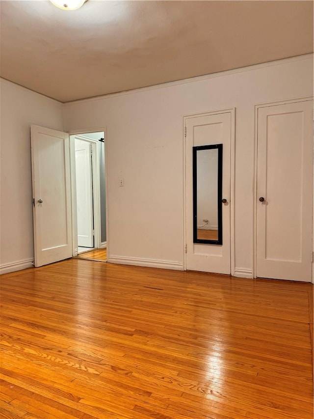 unfurnished room featuring light wood-type flooring