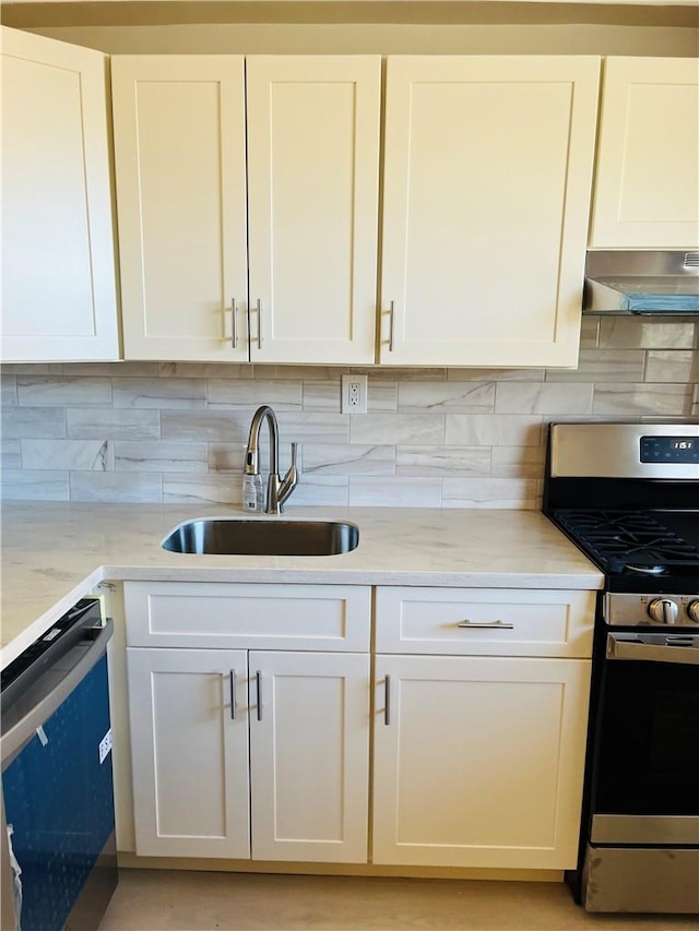 kitchen with gas stove, white cabinetry, dishwasher, sink, and exhaust hood