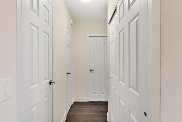 corridor with dark wood-type flooring