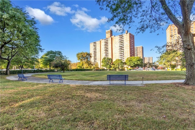 view of property's community with a lawn