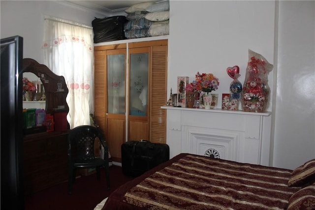 bedroom with a closet and ornamental molding