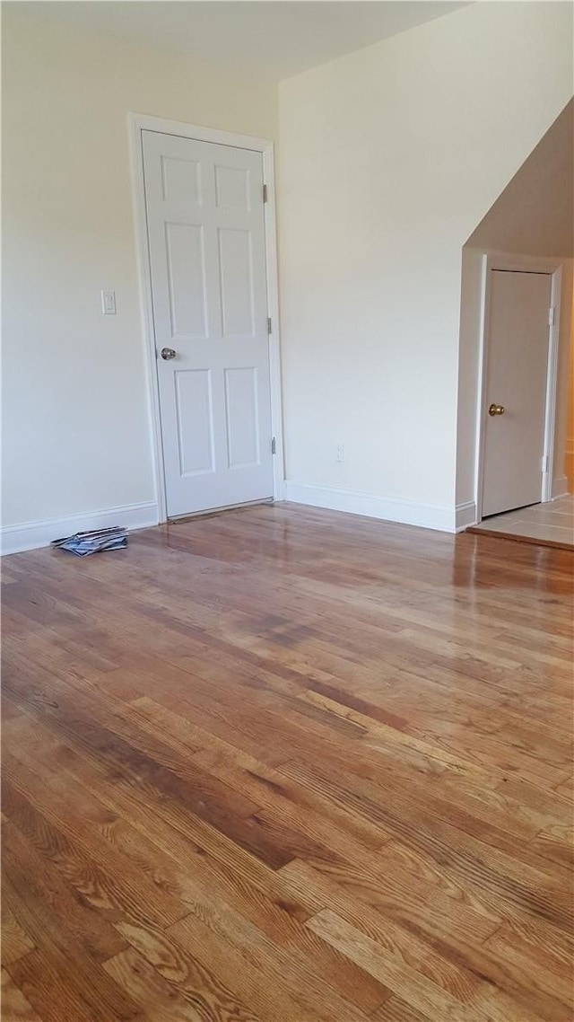 spare room with light hardwood / wood-style flooring