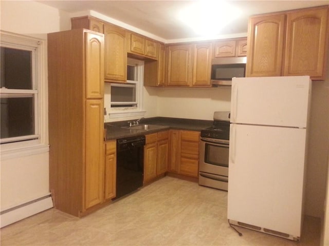 kitchen with sink, appliances with stainless steel finishes, and a baseboard radiator