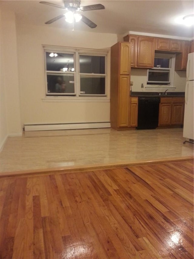 kitchen featuring a baseboard heating unit, black dishwasher, light hardwood / wood-style floors, and white refrigerator