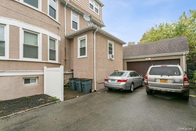 view of side of property with a garage