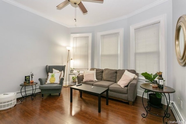 living room featuring ornamental molding, dark wood-type flooring, and a baseboard heating unit