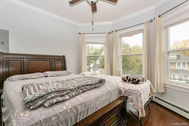 bedroom with ceiling fan, crown molding, dark wood-type flooring, and a baseboard heating unit