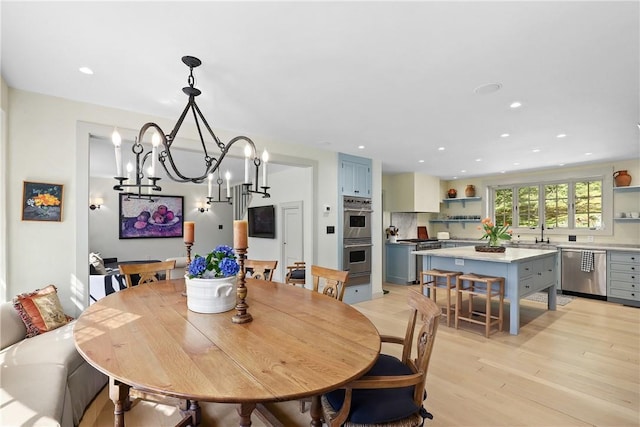 dining room featuring a chandelier and light hardwood / wood-style floors