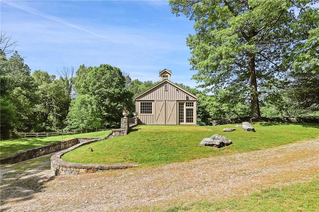 view of outdoor structure featuring a yard