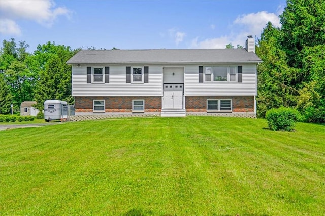 7 Joan Ln, Wappingers Falls, NY 12590 - split foyer home with a front yard, a chimney, and brick siding