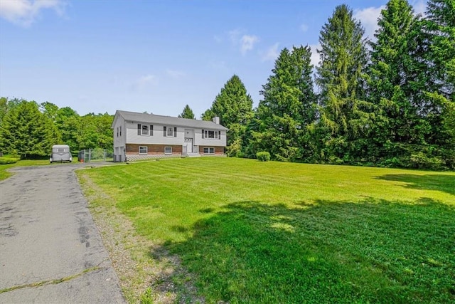 7 Joan Ln, Wappingers Falls, NY 12590 - bi-level home with a chimney and a front yard
