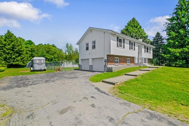 7 Joan Ln, Wappingers Falls, NY 12590 - view of front of home with driveway and a garage