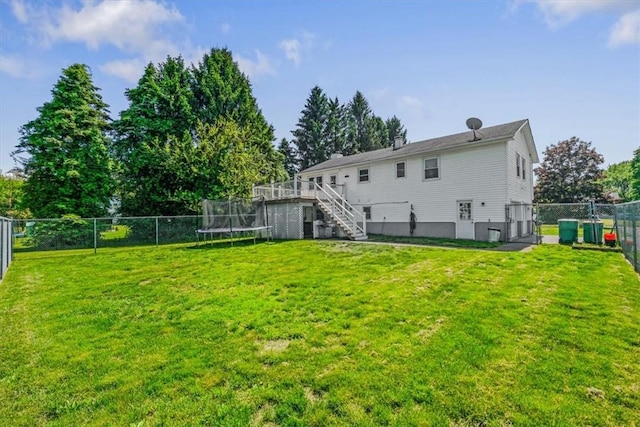 7 Joan Ln, Wappingers Falls, NY 12590 - back of house featuring stairs, a trampoline, and a deck