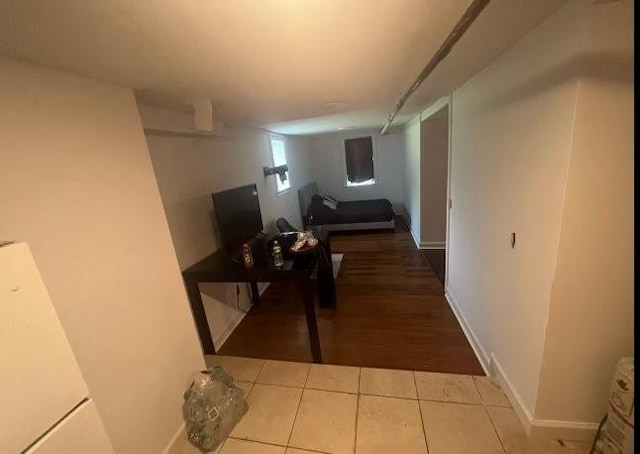 hallway with light tile patterned floors