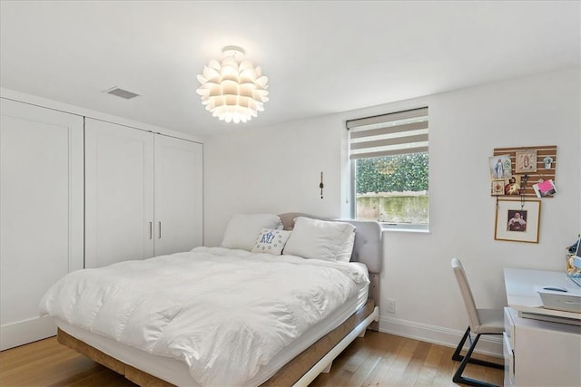 bedroom with light wood-type flooring