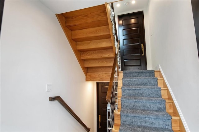 stairs with wood-type flooring