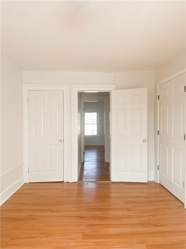 unfurnished room with light hardwood / wood-style flooring