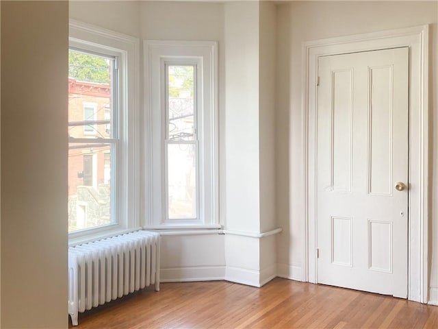 interior space featuring light hardwood / wood-style floors and radiator heating unit