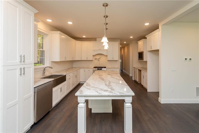 kitchen featuring white cabinets, sink, and appliances with stainless steel finishes