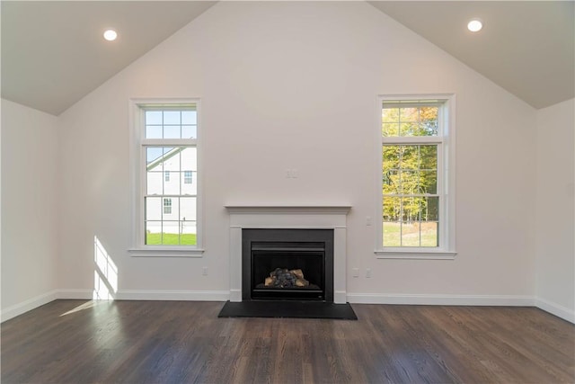 unfurnished living room with high vaulted ceiling and dark hardwood / wood-style floors