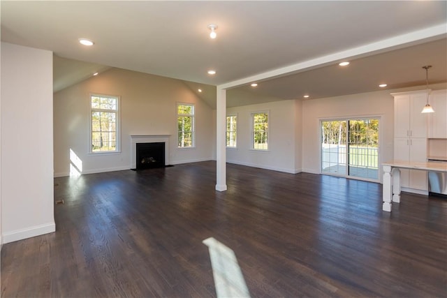 unfurnished living room featuring dark hardwood / wood-style floors and lofted ceiling