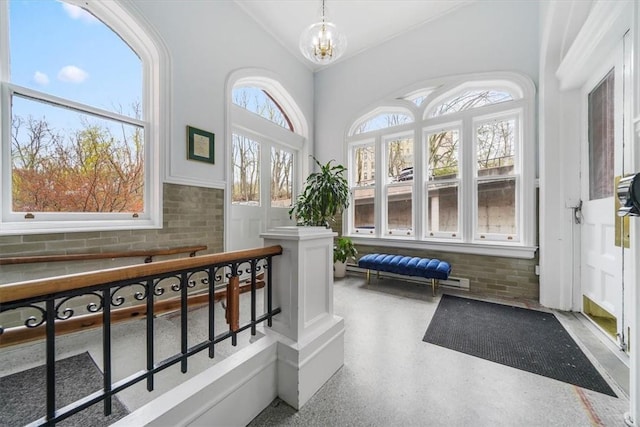 interior space with an inviting chandelier and a wealth of natural light